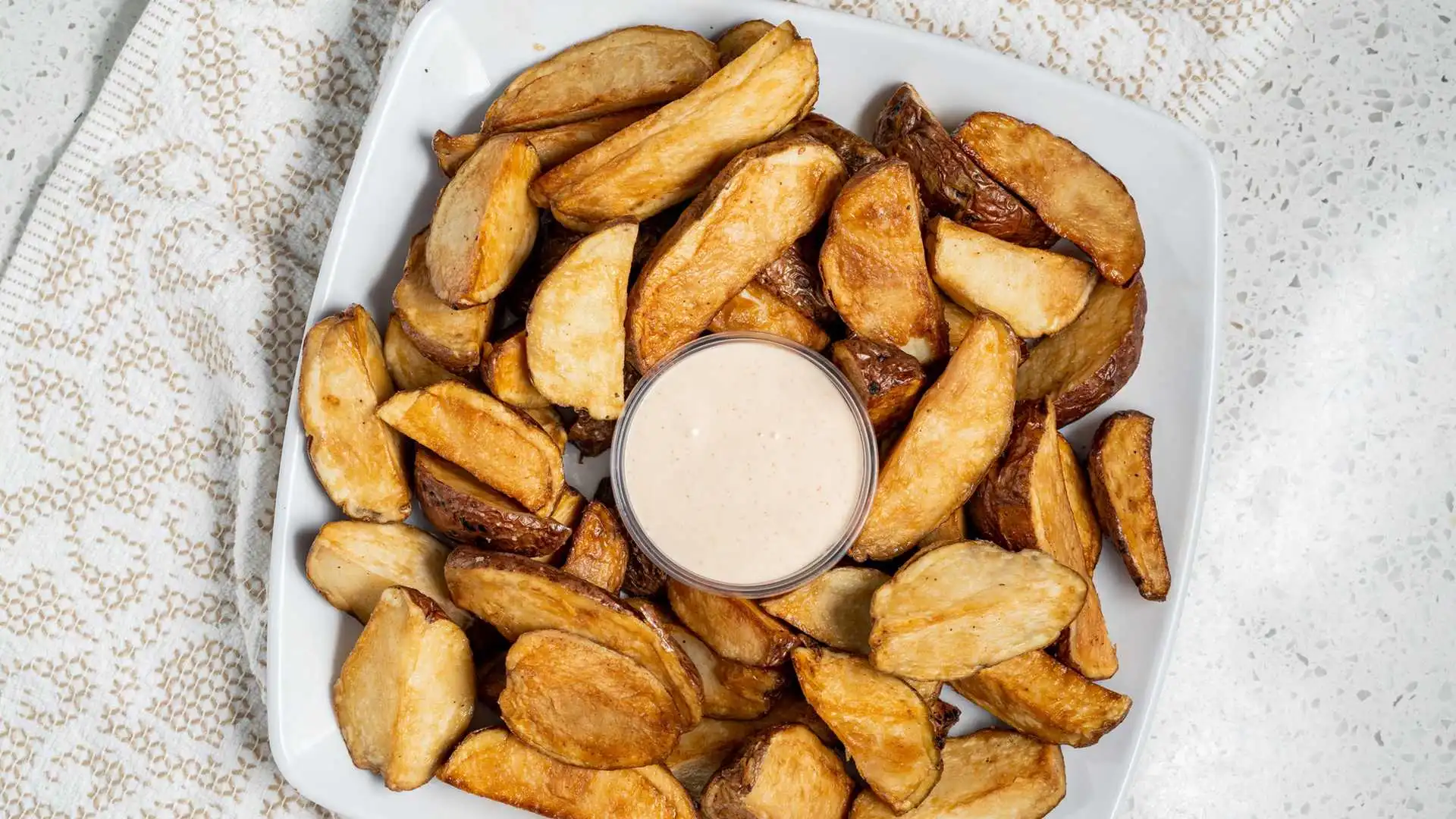 Garlic Potatoes with Sauce at Eat-A-Pita Calgary - Popular appetizer